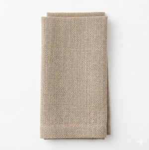 A single Amelia Beige Linen napkin, elegantly textured and neatly folded, perfect for event settings on a white background.