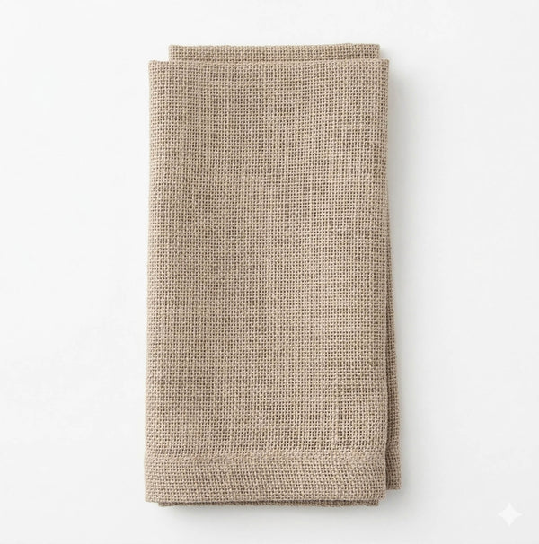 A single Amelia Beige Linen napkin, elegantly textured and neatly folded, perfect for event settings on a white background.