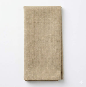 A neatly folded Amelia Cream Linen napkin rests on a plain white background, highlighting its elegant textured fabric—ideal for any refined event setting.