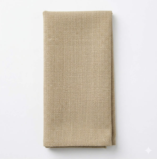 A neatly folded Amelia Cream Linen napkin rests on a plain white background, highlighting its elegant textured fabric—ideal for any refined event setting.