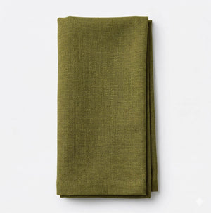 A neatly folded Amelia Pale Green Linen napkin with a subtle textured pattern and elegant fabric, displayed on a plain white background.