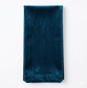 The Charlotte Blue Velvet napkin, neatly folded in a rectangle, rests on a plain white background.