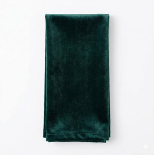 The Charlotte Dark Green Velvet napkin is neatly folded and displayed on a white background.