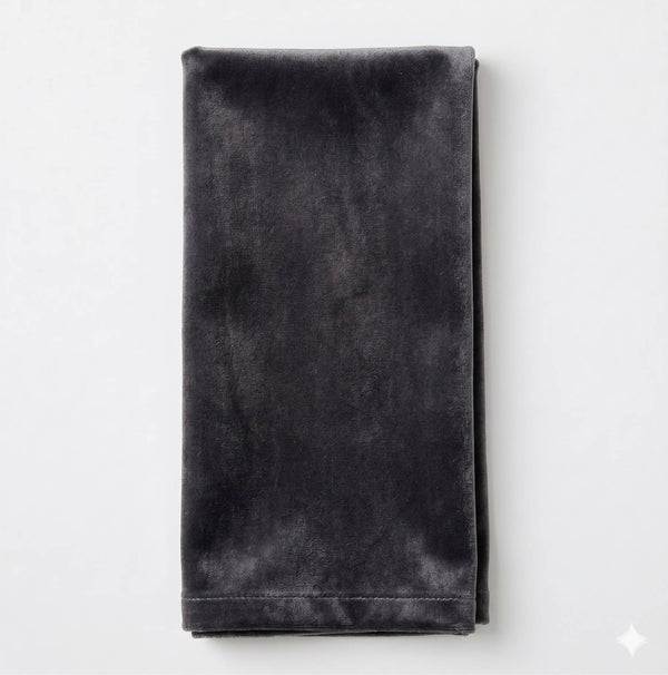 The Charlotte Grey Velvet napkin, neatly folded and laid flat on a white surface, adds a luxurious touch to your event decor.