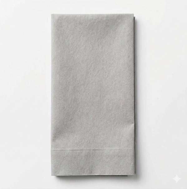 The Charlotte Light Grey Velvet napkin is neatly folded and set on a white background, adding an elegant touch that complements luxurious fabric or sophisticated event décor.