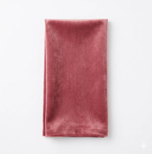 The Charlotte Old Pink Velvet fabric is soft and luxurious, neatly folded and displayed on a white background.