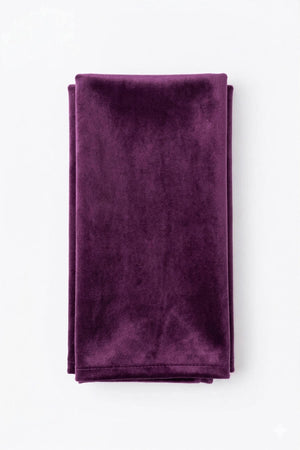 The Charlotte Purple Velvet fabric, neatly folded in a rectangular shape, is displayed on a plain white background.