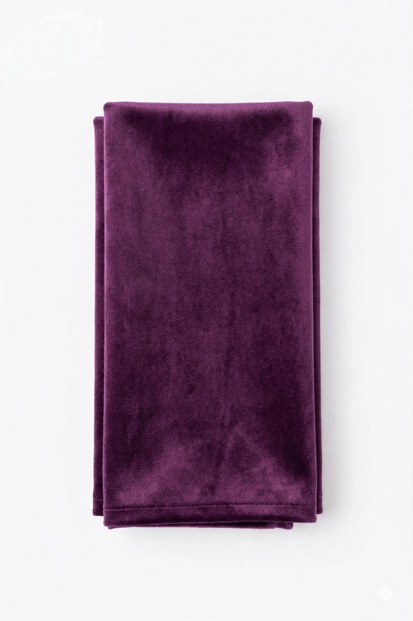 The Charlotte Purple Velvet fabric, neatly folded in a rectangular shape, is displayed on a plain white background.