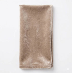 A neatly folded Charlotte Soft Brown Velvet napkin is displayed against a plain white background.