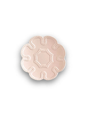 A pale pink, flower-shaped ceramic plate with scalloped edges and a raised dotted border from the Annalise Pink Plate Range, shown from above on a white background, adds vintage romance to any table setting.