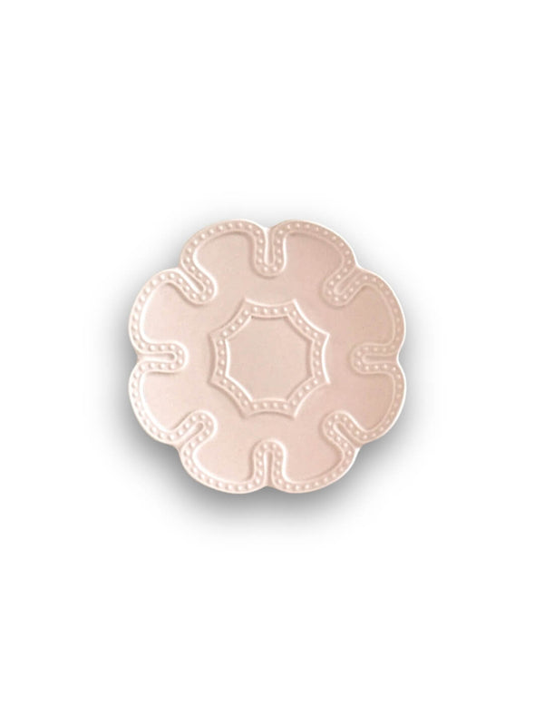 A pale pink, flower-shaped ceramic plate with scalloped edges and a raised dotted border from the Annalise Pink Plate Range, shown from above on a white background, adds vintage romance to any table setting.