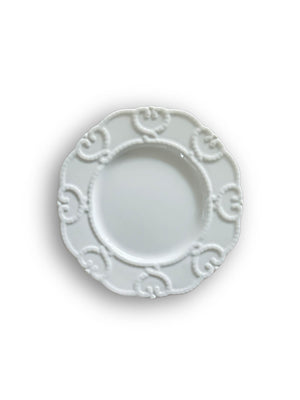 Annalise White Plate Range features vintage-inspired plates with embossed patterns and scalloped edges, shown from above on a white background.