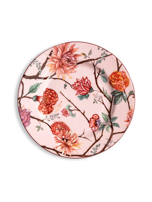 A round ceramic plate from the Botanic Pink Plate Range, featuring a pale pink background with a colorful floral design of red, orange, and pink flowers, green leaves, and brown branches.