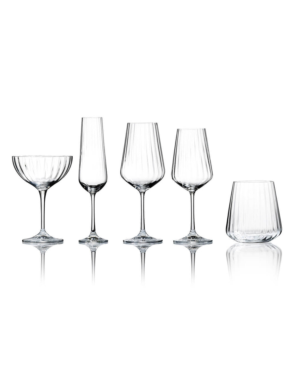 The Catherine Glassware Range includes five clear, empty pieces—a coupe, flute, two wine glasses, and a tumbler—each with a subtle ripple pattern, elegantly displayed on a white background for luxury weddings.