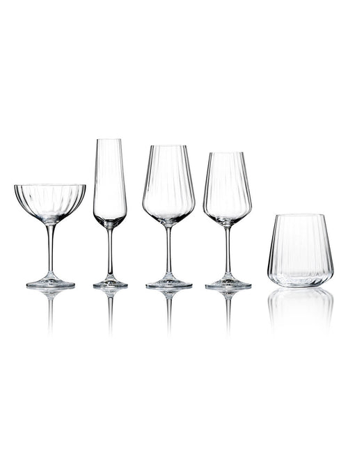 The Catherine Glassware Range includes five clear, empty pieces—a coupe, flute, two wine glasses, and a tumbler—each with a subtle ripple pattern, elegantly displayed on a white background for luxury weddings.