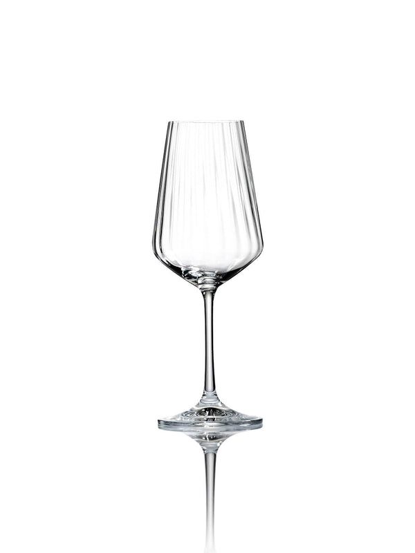 A clear, empty, stemmed wine glass from the Catherine Glassware Range features a faceted ripple pattern on a white background with a soft reflection—ideal for luxury weddings.