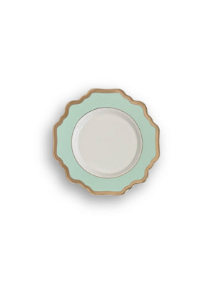 The Colette Green Plate Range features round plates with scalloped edges, gold rims, and light green borders framing a white center—modern charm against a crisp white background.