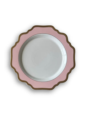 An overhead view of a round white plate from the Colette Pink Plate Range, featuring a pink scalloped border and gold trim—a refined addition to luxury tableware.