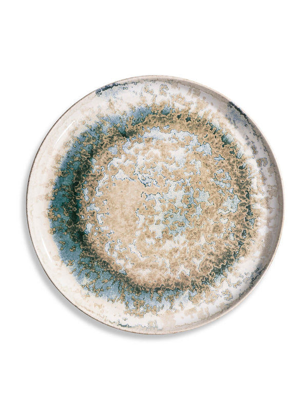 The Cove Plate Range features round ceramic plates with abstract beige, blue, and green glaze patterns—evoking mineral or watercolor effects for an artisanal touch to your table.