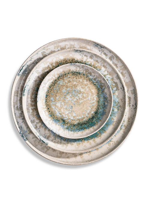 The Cove Plate Range features three ceramic plates of different sizes, stacked and showcasing a rustic speckled beige and blue-green glaze—ideal for lovers of artisanal dinnerware.