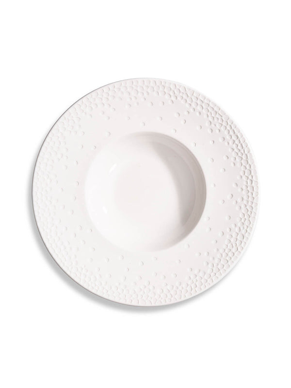 A wide-rimmed white ceramic soup plate from the Dotty Plate Range, with an embossed dot pattern, is shown in a top-down view on a plain white background.