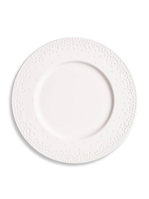 The Dotty Plate Range features a plain white ceramic plate with an embossed dot pattern on the rim, shown against a white background—ideal for modern tableware collections.