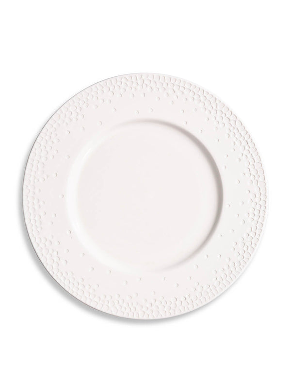 The Dotty Plate Range features a plain white ceramic plate with an embossed dot pattern on the rim, shown against a white background—ideal for modern tableware collections.