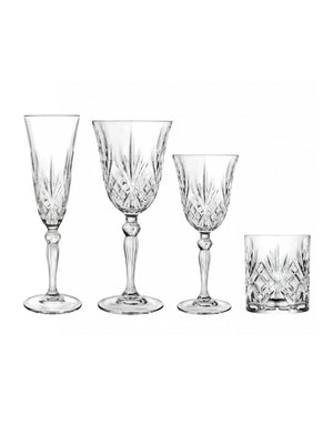 Four vintage-inspired crystal glasses from the Edith Glassware Range, including a flute, two stemmed glasses, and a short tumbler with intricate cut patterns, are arranged in a row on a white background.