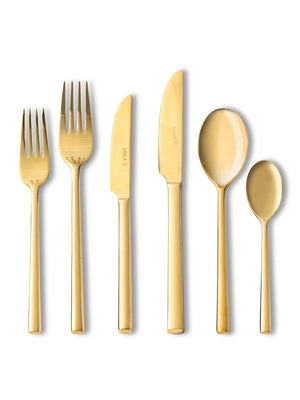 Six pieces from the Gaia Gold Cutlery Range‚Äîtwo forks, two knives, and two spoons in different sizes with a gleaming metallic finish‚Äîare arranged in a row and stand out against a crisp white background.
