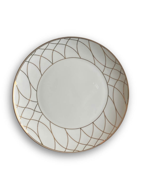 Part of the Grace Plate Range, this modern white ceramic plate features a gold geometric pattern of intersecting curved lines along the rim, while its plain center adds an elegant, uncluttered touch.