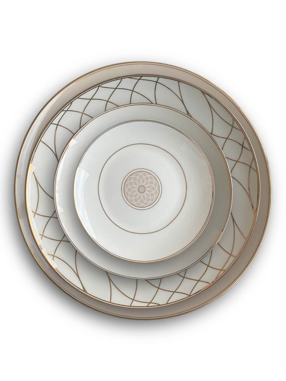 The Grace Plate Range features three nested white ceramic plates with gold rims and geometric patterns; the two larger plates have curved gold lines, while the smallest plate highlights a central gold floral design.