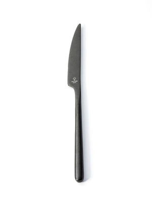 A single table knife from the Jett Cutlery Range, featuring a smooth handle and serrated blade in matte black, displayed on a white background.