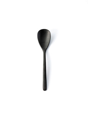A single spoon from the Jett Cutlery Range, finished in matte black, is centered on a plain white background, casting a subtle shadow to the right.