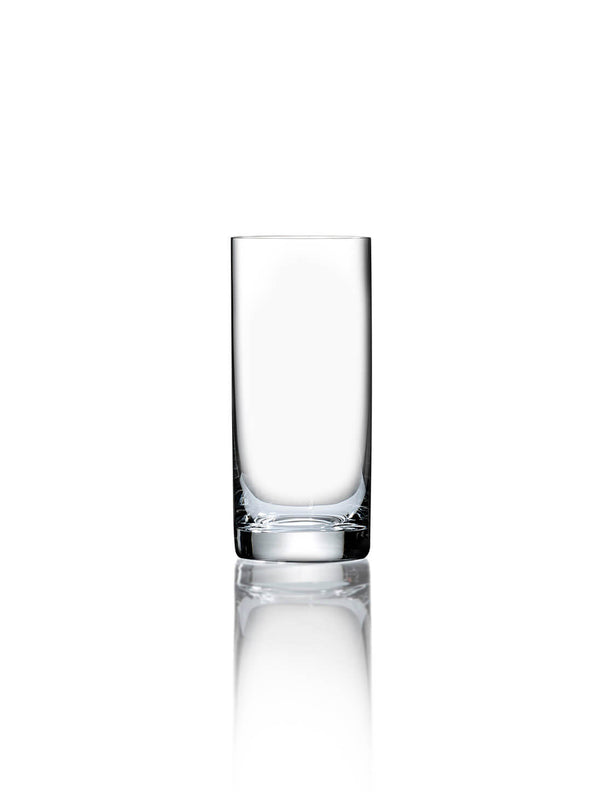 A clear, empty tumbler from the Lola Glassware Range sits centered on a white background with a subtle reflection, highlighting the elegance of modern glassware.