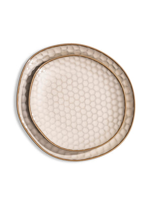 The Lorenzo Plate Range features handcrafted ceramic plates with an irregular oval shape, honeycomb texture, and gold rim—ideal for modern rustic weddings. Shown on a white background.