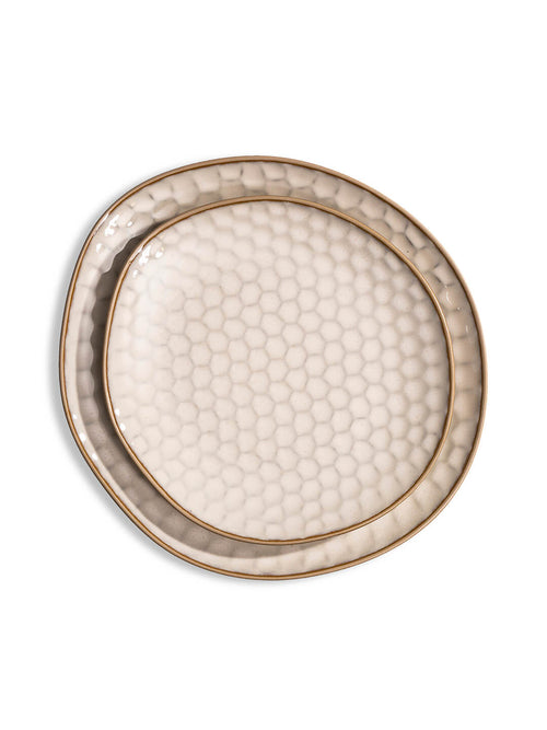 The Lorenzo Plate Range features handcrafted ceramic plates with an irregular oval shape, honeycomb texture, and gold rim—ideal for modern rustic weddings. Shown on a white background.