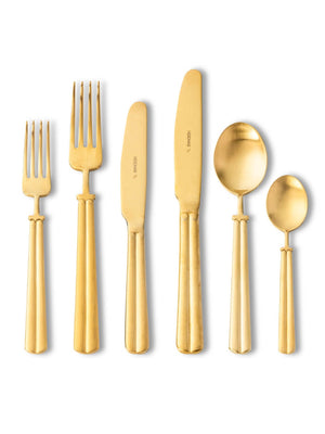 The Mete Gold Cutlery Range features six matte gold utensils‚Äîtwo forks, two knives, and two spoons‚Äîarranged on a white background to highlight their sleek, modern design.