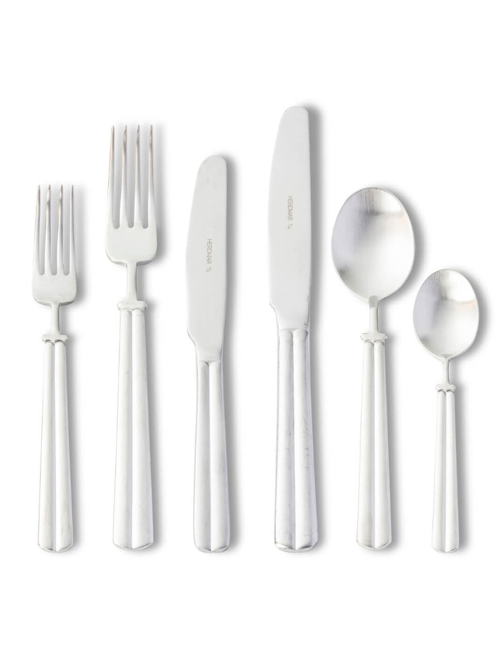Six pieces from the Mete Sliver Cutlery Range‚Äîtwo forks, two knives, and two spoons in different sizes‚Äîare displayed upright in a row on a white background, highlighting their luxury design.