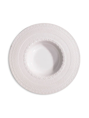 An Opaline Plate Range charger plate, white with a wide, ornate rim and intricate embossed floral designs, viewed from above on a plain background—ideal for an elegant table setting.