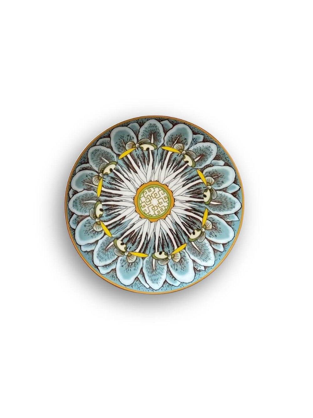 Stacked Paloma Plate Range tableware, showcasing pastel pink, green, yellow, blue, and white tones with floral, petal, and mandala-inspired patterns, viewed from above on a white background.