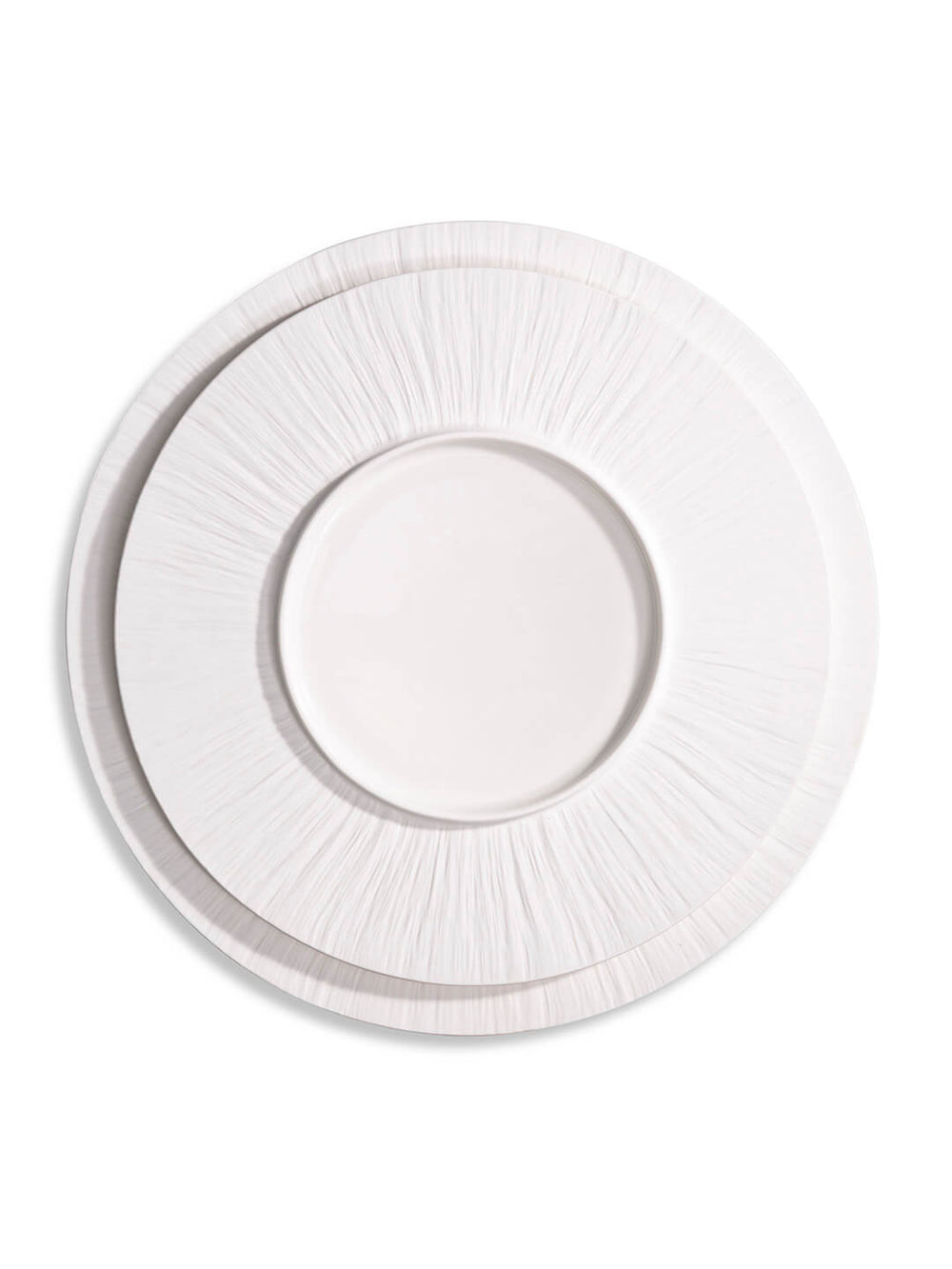 A round, white dinner plate from the Pandore Plate Range features a textured, radiating rim and embossed matte finish, shown from above on a white background.