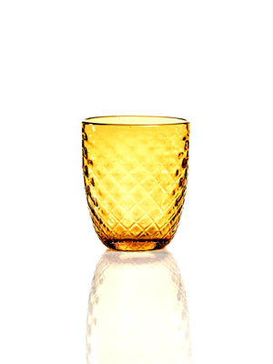 The Prisma Amber Tumbler features a charming faceted design with a textured diamond pattern. Set on a reflective white surface, it's ideal for autumn celebrations and stands out against a plain white background.