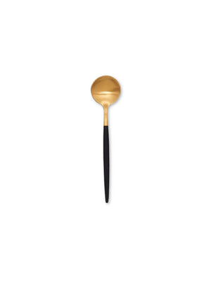 A gold spoon with a round bowl and long matte black handle from the Raven Cutlery Range is centered on a white background, showcasing modern luxury tableware.