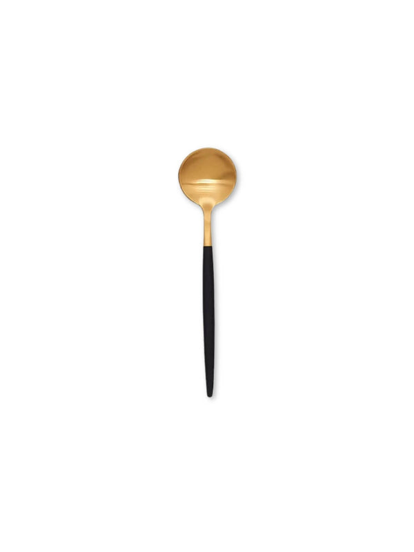 A gold spoon with a round bowl and long matte black handle from the Raven Cutlery Range is centered on a white background, showcasing modern luxury tableware.