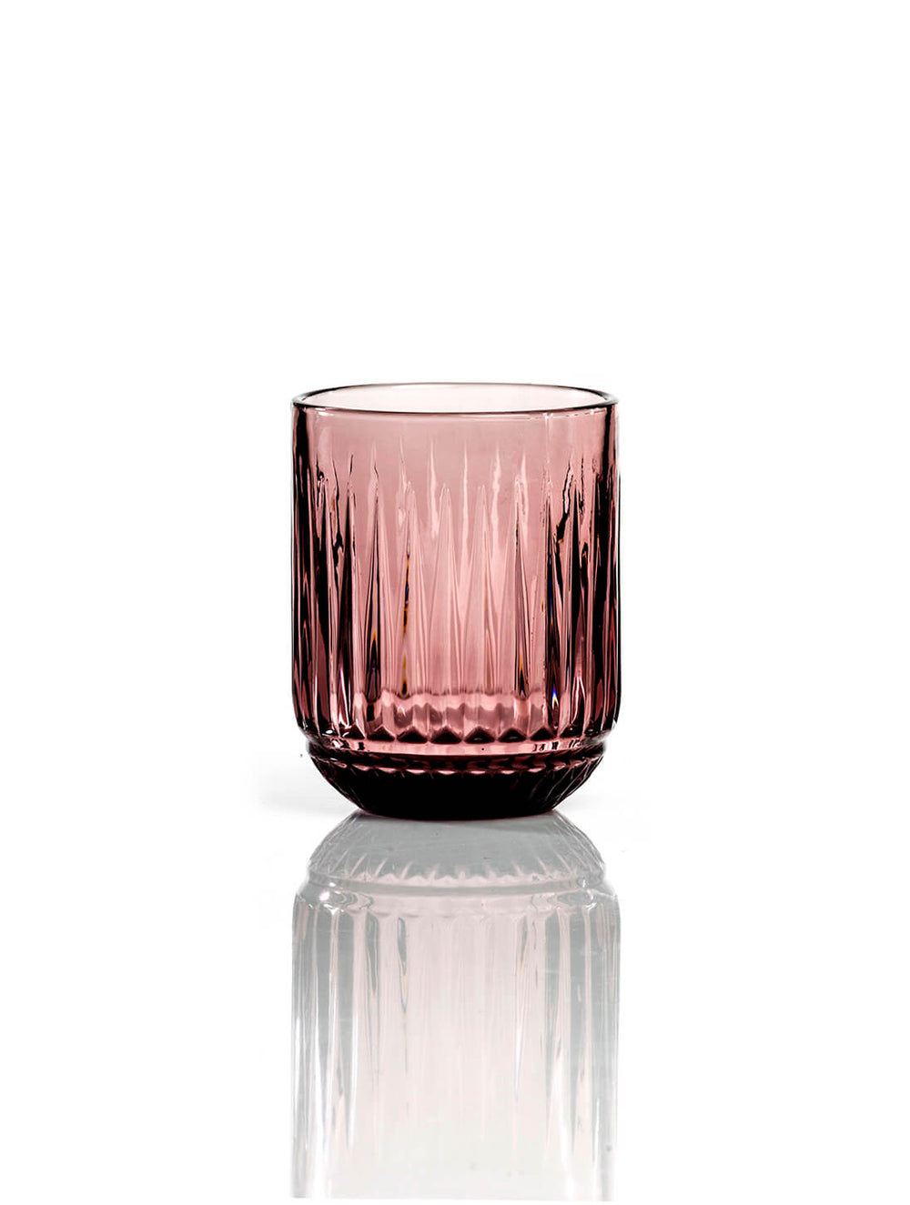 The Sass Plum Tumbler features pink-colored ribbed glass with vertical grooves in a short, wide shape—ideal for adding a modern touch to your tableware collection.