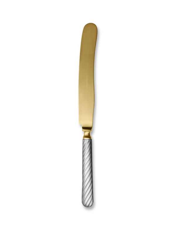 A butter knife from the Sefton Cutlery Range, featuring a gold, rounded blade and a silver handle with a diagonal striped pattern, displayed on a white background. This two-tone piece highlights elegant design.