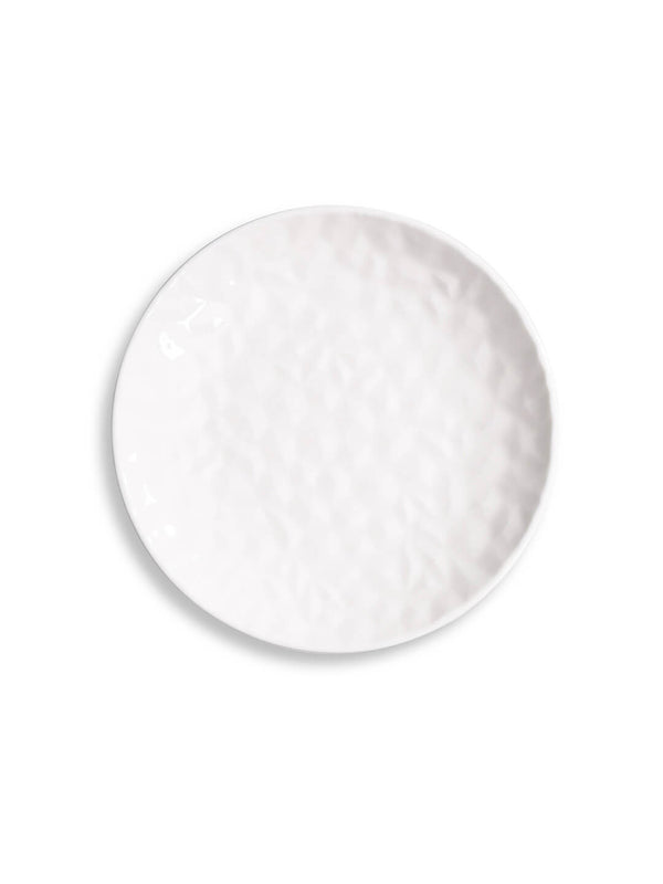 From the Sky Plate Range, a modern round white ceramic faceted plate with a dimpled, textured surface is displayed on a plain white background.