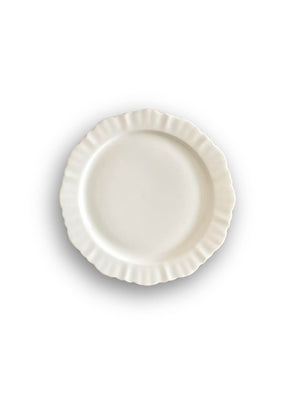 A white ceramic plate from the Sophia Plate Range with a ruffled edge, photographed from above on a white background—an elegant addition to any table setting.