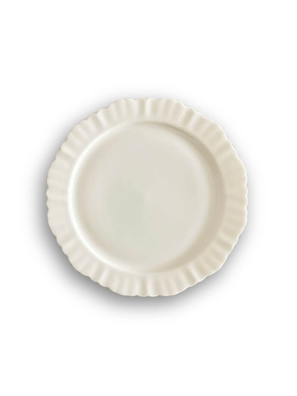 A plain, round white ceramic plate from the Sophia Plate Range with a ruffled edge, photographed from above on a white background—an elegant dinnerware option for any occasion.