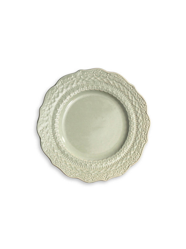 The Verdant Plate Range features round, white ceramic plates with ornate embossed floral and scroll patterns along scalloped edges, evoking vintage-inspired charm, shown on a plain white background.